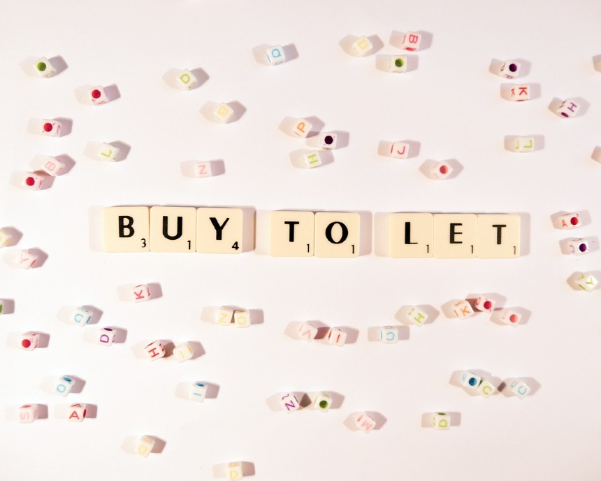 Wooden letters spelling buy to let