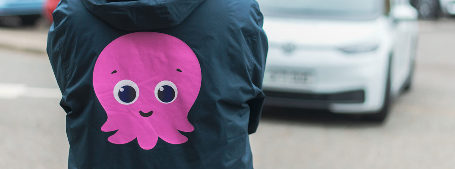 EV in the background with a constantine hoodie in front